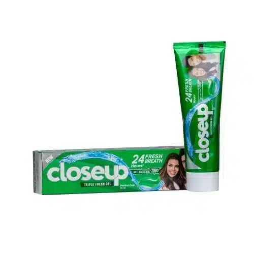Closeup of mint gel toothpaste with green branding.